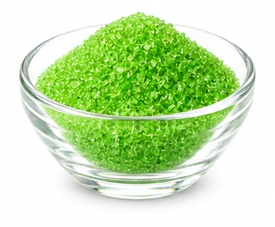 Glass bowl of green apple sugar crystals